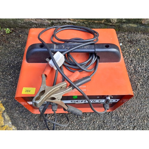 384 - A red Sealey Service 60, 12volt jump box with leads. Location:G