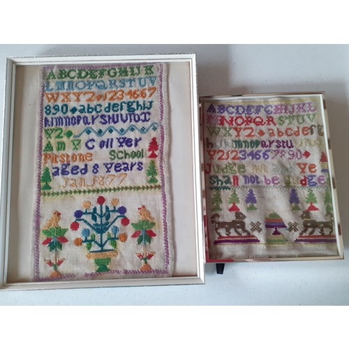 128 - Two late 19th Century framed samplers, an Indian wall hanging on purple felt ground having silver me... 