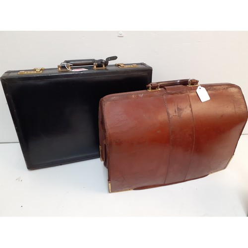 153 - A black Jacob leather briefcase together with two earlier brown leather briefcases Location:1.1