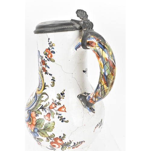 421 - A delft and pewter mounted polychrome 'chinoiserie' puzzle jug, with shell detail to thumbpiece, the... 