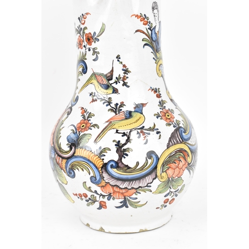 421 - A delft and pewter mounted polychrome 'chinoiserie' puzzle jug, with shell detail to thumbpiece, the... 