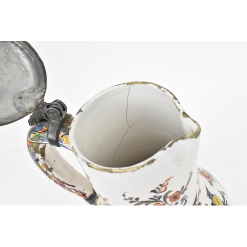 421 - A delft and pewter mounted polychrome 'chinoiserie' puzzle jug, with shell detail to thumbpiece, the... 