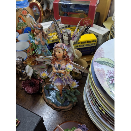 409 - A mixed lot to include Country Artists Secrets Fairy models, other fairy models from the Leonardo Co... 