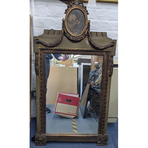 477 - An early 20th century French mirror having an oval engraving to the top with ribbon motif, with saus... 