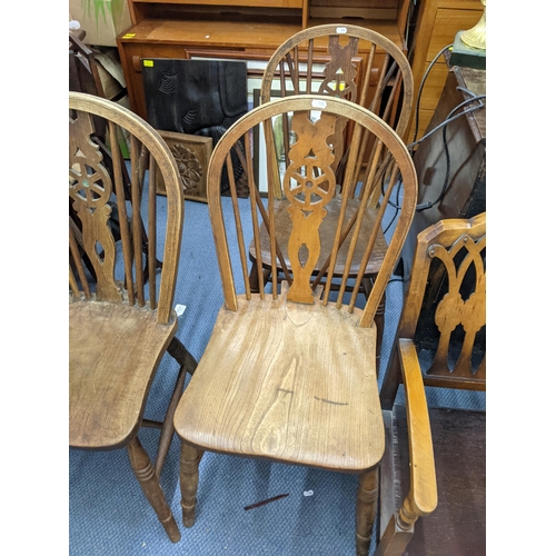 483 - Mixed chairs to include a set of Windsor spindle back chairs and two walnut low  armchairs
Location:... 