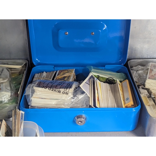 496 - A collection of cigarette and tea cards to include Wills, John Player, PG Tips and others along with... 