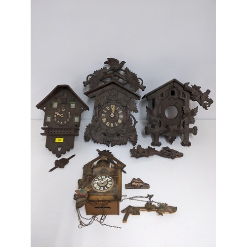 398 - Four late 19th/early 20th century wooden cased cuckoo clocks, for repairs or spares Location:G