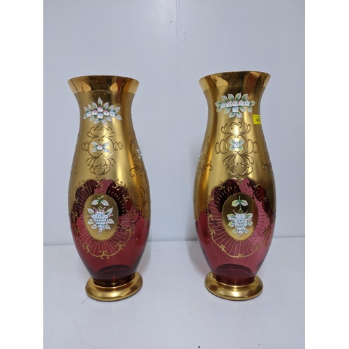 402 - A pair of large Venetian glass vases decorated with enamelled flowers in relief and gilt work, 52cm ... 