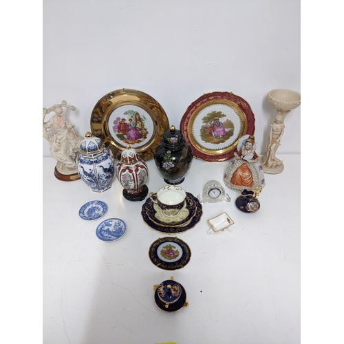 408 - A selection of ceramic and resin ornaments to include Limoges china, Waterford clock, Victorian trio... 