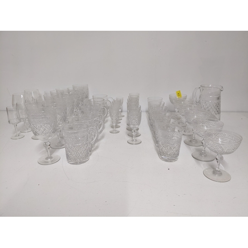 413 - Tudor Crystal part suite of cut table glass to include six champagne glasses, and other drinking gla... 