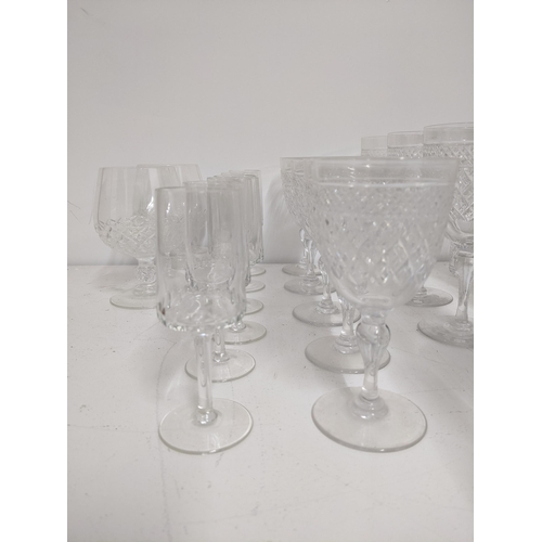 413 - Tudor Crystal part suite of cut table glass to include six champagne glasses, and other drinking gla... 