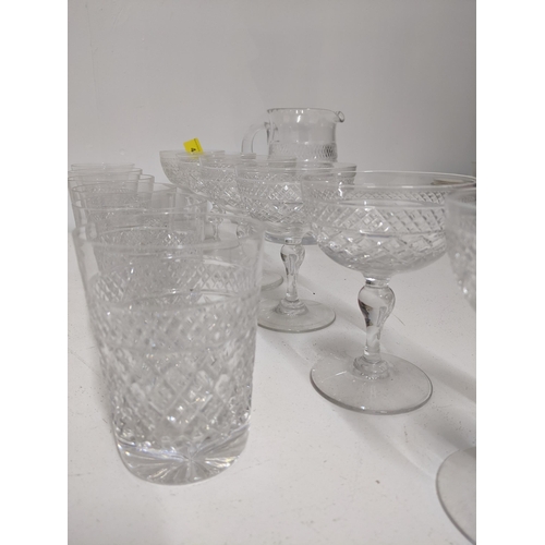 413 - Tudor Crystal part suite of cut table glass to include six champagne glasses, and other drinking gla... 