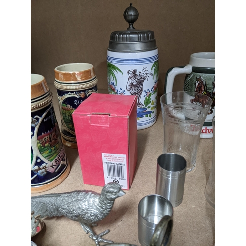 418 - A mixed lot of silver, silver plate, pub memorabilia to include German steins, and other items inclu... 