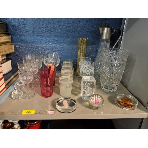 264 - Mixed glassware to include a claret jug with a silver plated top, paperweights, and other items Loca... 