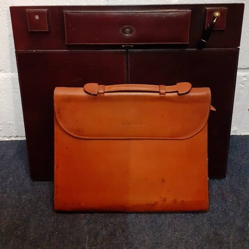 156 - A late 20th Century Swaine Adeney Brigg brown leather folio with zipped sides to convert into a desk... 