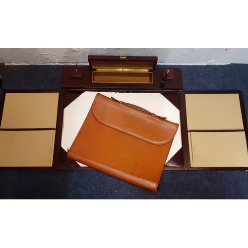 156 - A late 20th Century Swaine Adeney Brigg brown leather folio with zipped sides to convert into a desk... 