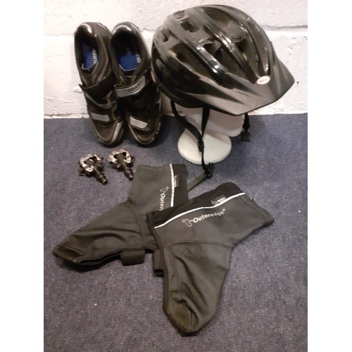 157 - A pair of gents Shimano black and silver cycle shoes, size 44 with cleats together with a Bell black... 