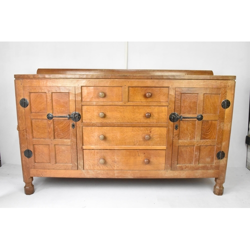 56 - Robert 'Mouseman' Thompson (1876-1955) An oak panelled sideboard, circa 1955, adzed throughout, rais... 