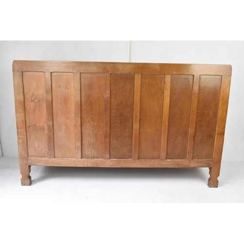 56 - Robert 'Mouseman' Thompson (1876-1955) An oak panelled sideboard, circa 1955, adzed throughout, rais... 