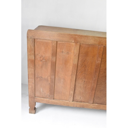 56 - Robert 'Mouseman' Thompson (1876-1955) An oak panelled sideboard, circa 1955, adzed throughout, rais... 