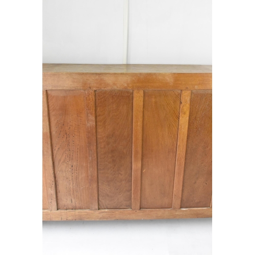 56 - Robert 'Mouseman' Thompson (1876-1955) An oak panelled sideboard, circa 1955, adzed throughout, rais... 