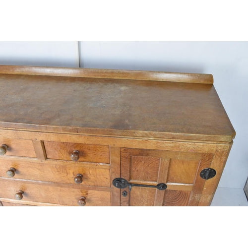 56 - Robert 'Mouseman' Thompson (1876-1955) An oak panelled sideboard, circa 1955, adzed throughout, rais... 