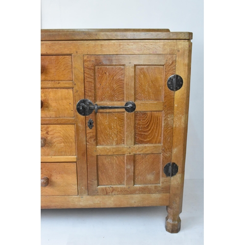 56 - Robert 'Mouseman' Thompson (1876-1955) An oak panelled sideboard, circa 1955, adzed throughout, rais... 