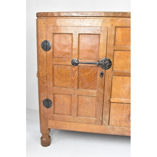 56 - Robert 'Mouseman' Thompson (1876-1955) An oak panelled sideboard, circa 1955, adzed throughout, rais... 