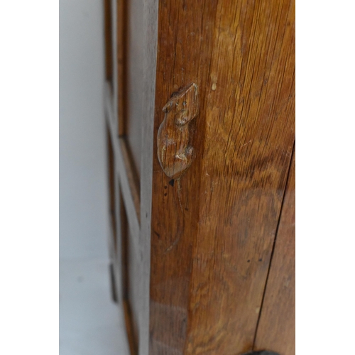 56 - Robert 'Mouseman' Thompson (1876-1955) An oak panelled sideboard, circa 1955, adzed throughout, rais... 