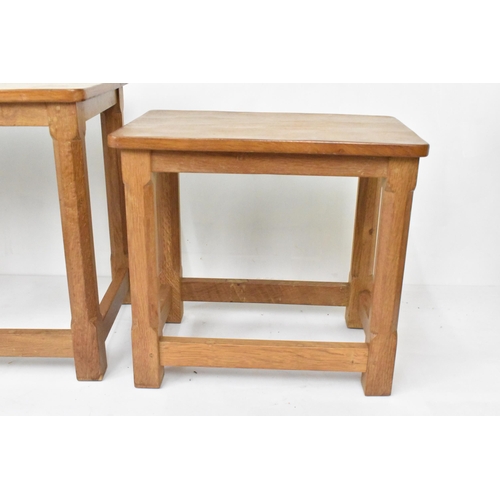 58 - Robert 'Mouseman' Thompson (1876-1955) A nest of three graduating oak 'Mouseman' tables, circa 1979,... 