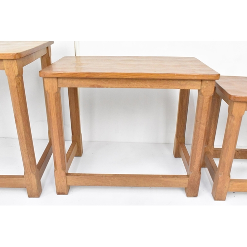 58 - Robert 'Mouseman' Thompson (1876-1955) A nest of three graduating oak 'Mouseman' tables, circa 1979,... 