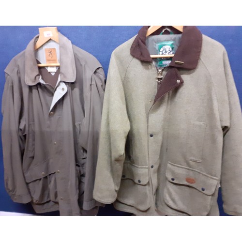 305 - An Oxford Wear green herringbone country pursuit jacket with brown cord collar and Oxford badge, siz... 