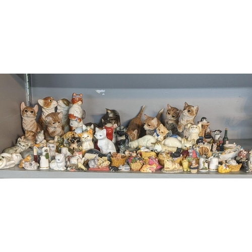 307 - A quantity of china cats and items to include cats of character 'Sitting Pretty', 'Tired Tom' and ot... 