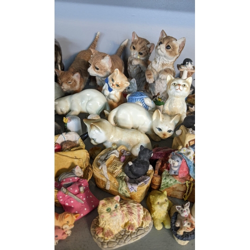 307 - A quantity of china cats and items to include cats of character 'Sitting Pretty', 'Tired Tom' and ot... 