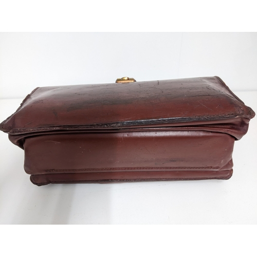 153 - A black Jacob leather briefcase together with two earlier brown leather briefcases Location:1.1