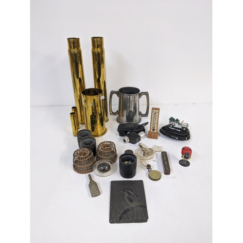 457 - A mixed lot to include WWII shell casings, a twin handled tankard and other items, Location:7.1