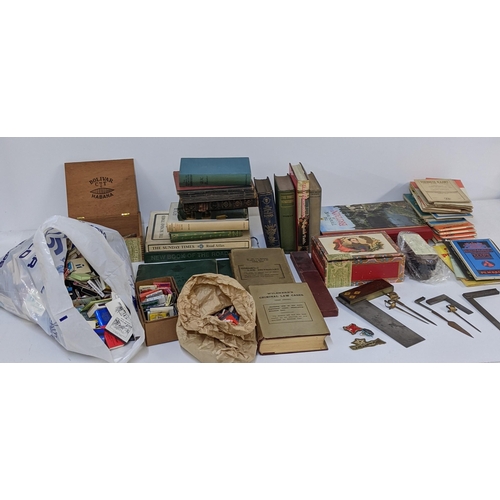 473 - A mixed lot to include mixed books and a quantity of matches, vintage set squares and other items, L... 