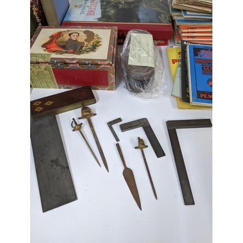 473 - A mixed lot to include mixed books and a quantity of matches, vintage set squares and other items, L... 