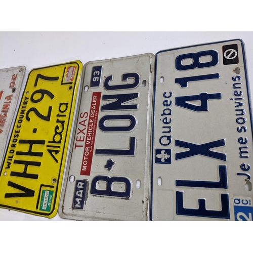 486 - A group of American pressed metal number plates, Location:LAM