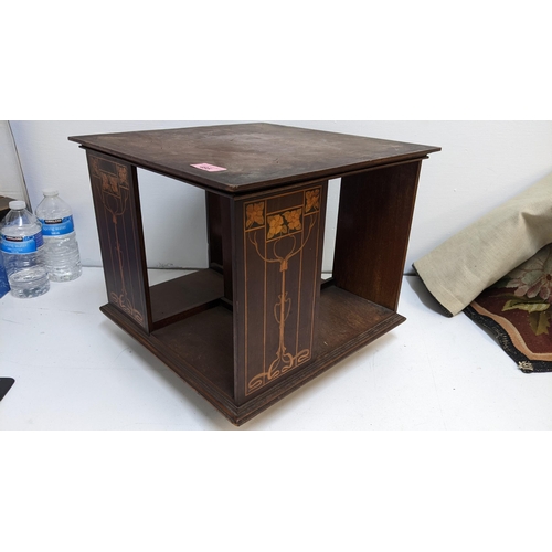 495 - An Art Nouveau inlaid mahogany table top rotating bookcase, Location:G