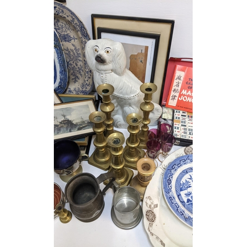 498 - Brassware to include candlesticks, a Staffordshire model dog, glasses, a Mah Jong set, prints and me... 