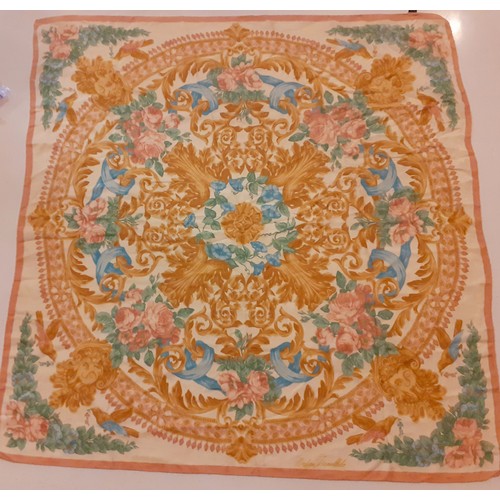 76 - A group of vintage silk scarves to include a Tiffany & co scarf, a Parisian Jean Desprez cream and b... 