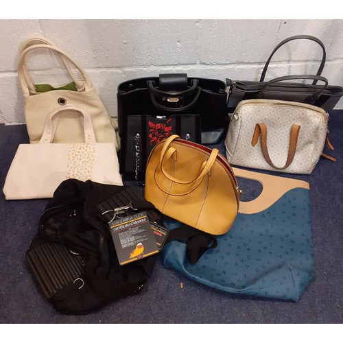 239 - A quantity of modern fashion bags to include a late 20th Century cream Radley handbag with leaf cut-... 