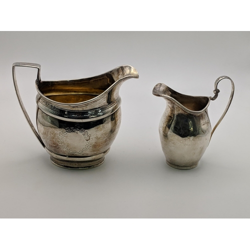 113 - Two silver jugs, one bearing indistinct marks, the other marked London 1915, 246.5g Location: 1.1