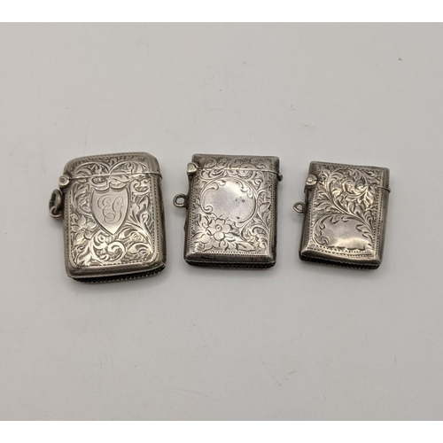 133 - Three silver vesta cases, all having floral engraved detail, to include one dated Birmingham 1905, t... 