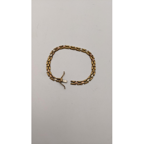 135 - A 9ct gold and white metal tri-coloured bracelet A/F 6g Location: CAB5