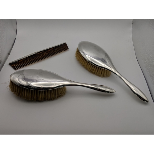 43 - An early 20th century silver backed five piece dressing table set, boxed and a comb
Location: A2B