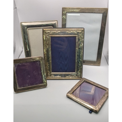 101 - Five silver and white metal photo frames to include a silver photo frame hallmarked Birmingham 1928,... 