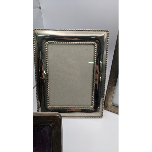 101 - Five silver and white metal photo frames to include a silver photo frame hallmarked Birmingham 1928,... 