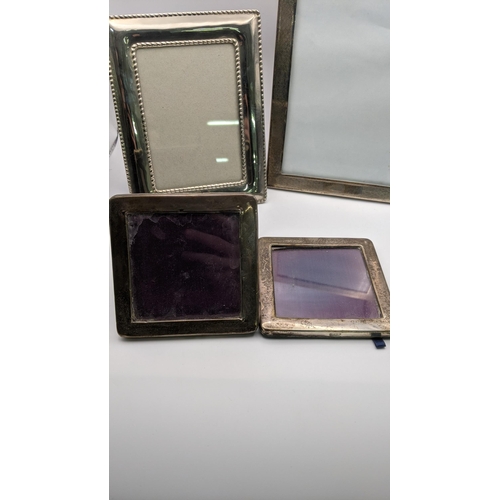 101 - Five silver and white metal photo frames to include a silver photo frame hallmarked Birmingham 1928,... 